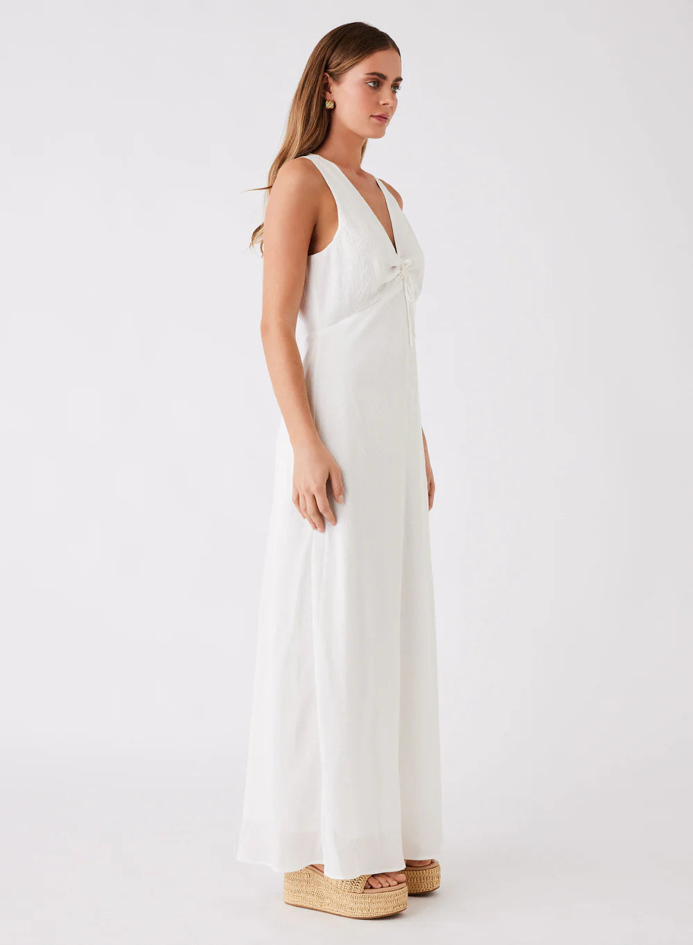 Island dress in white. Maxi length with tie at bust.