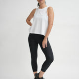 Organic cotton white singlet with cut in arms and swing hem